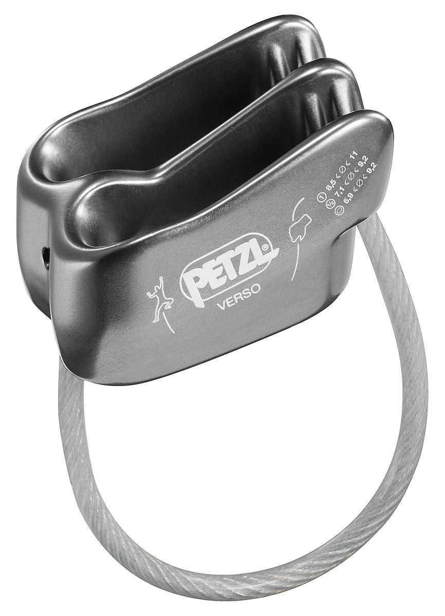 Lightweight gray aluminum Petzl Verso belay device with V-shaped friction grooves and an attached steel cable loop.