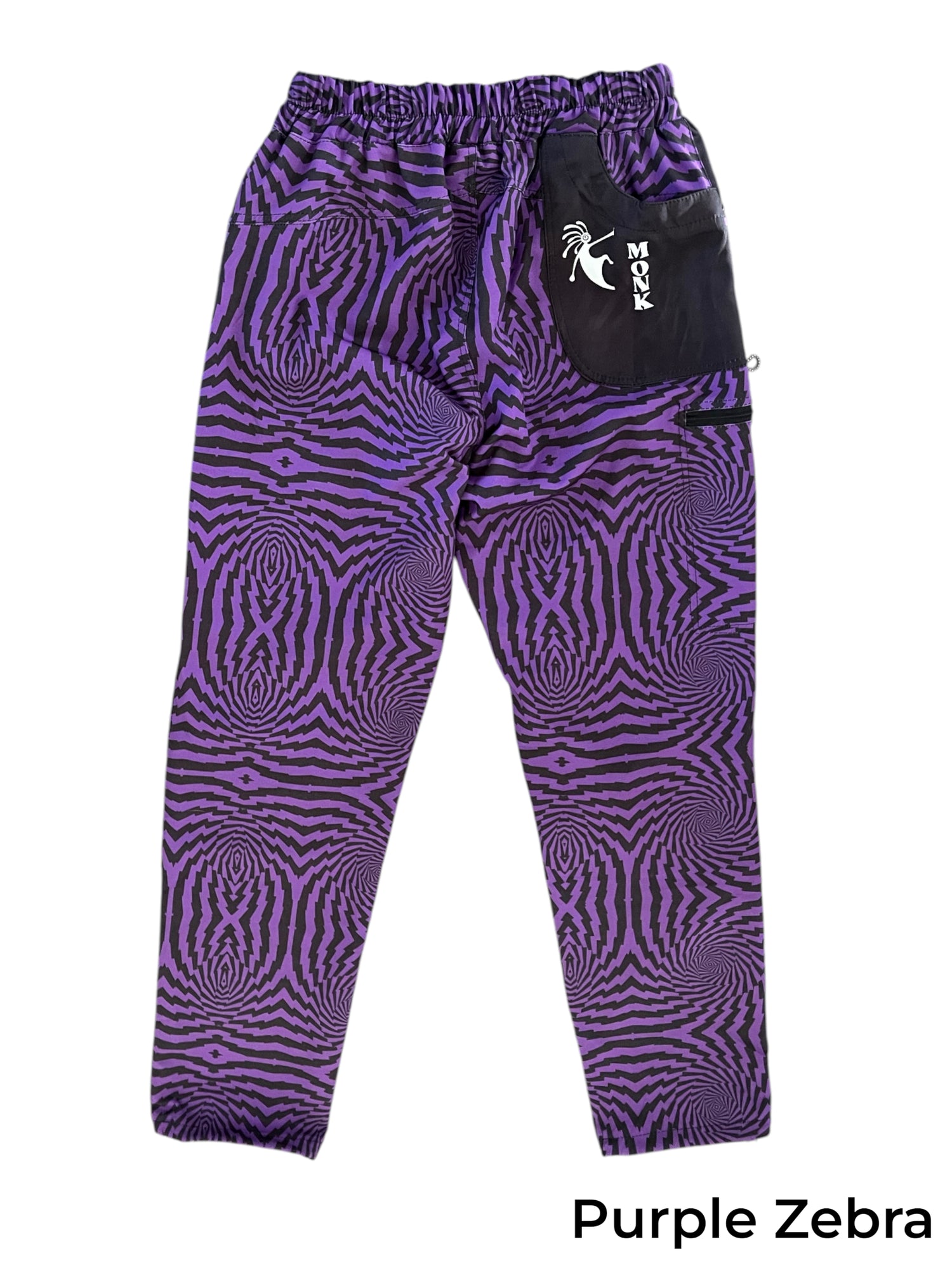 Purple zebra print TURK MOUNTAIN men's climbing pants with black elastic waistband and pocket.