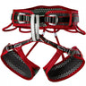 Red Ocun Webee 3-buckle climbing harness featuring a breathable, perforated honeycomb padding design.